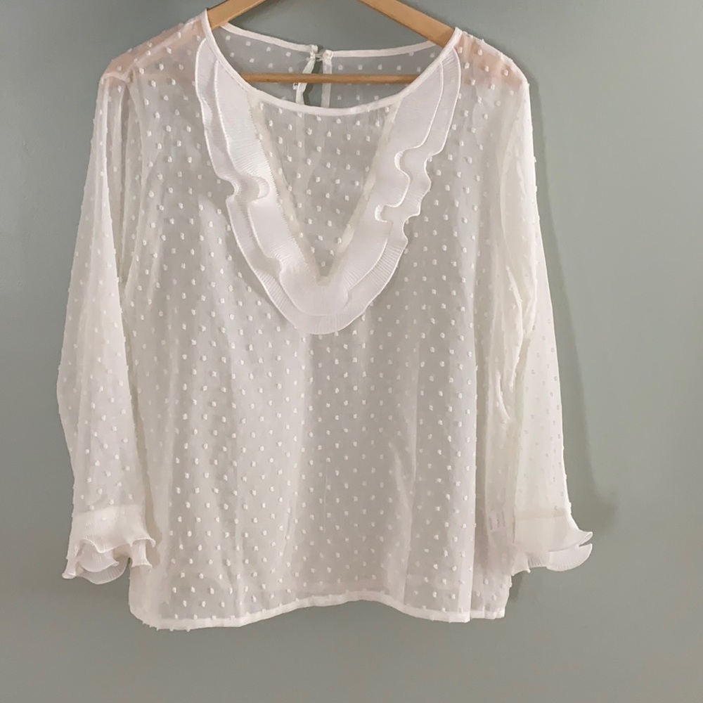 This white blouse is an XL.